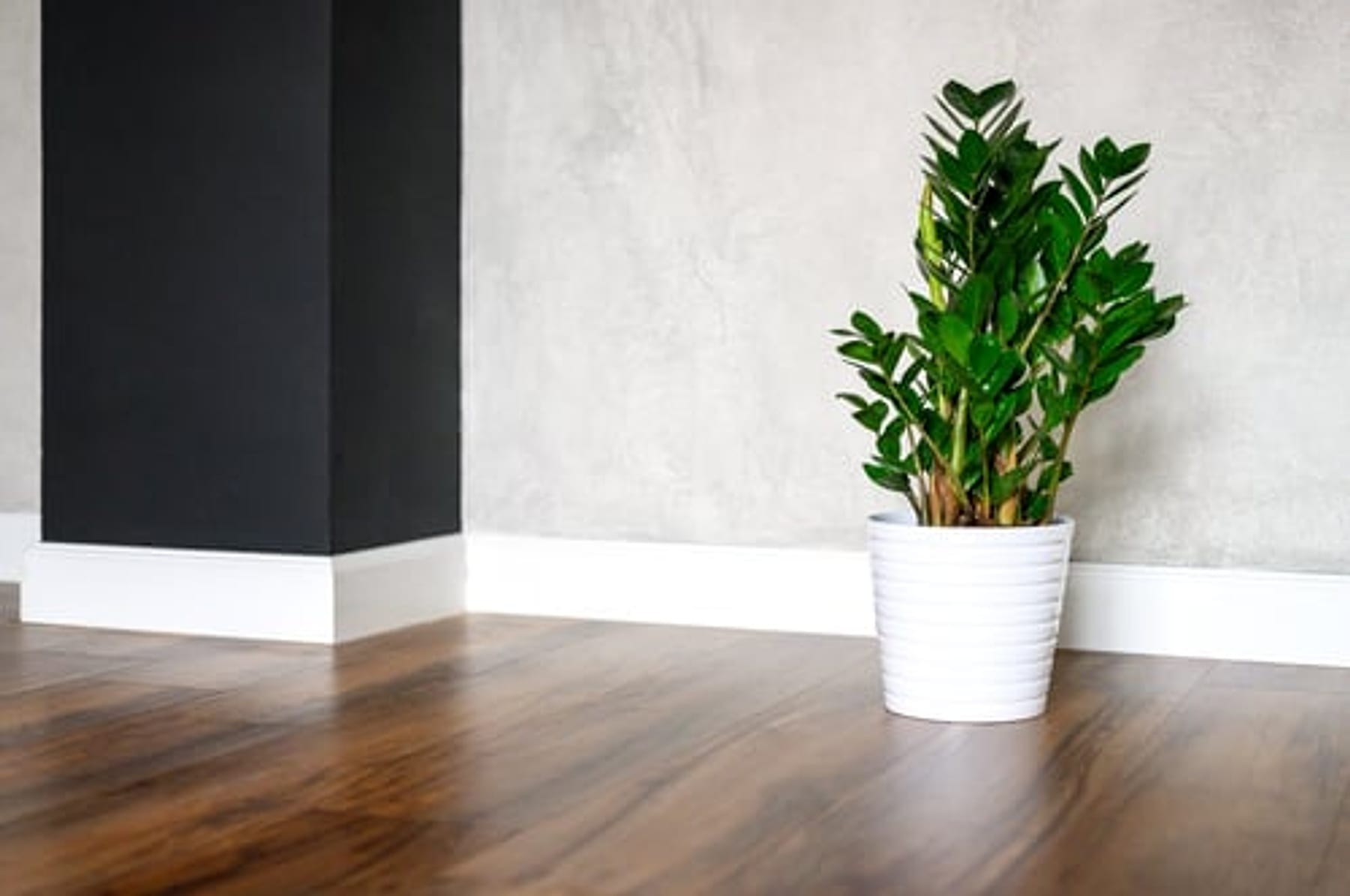 Finished dark hardwood flooring installed in a modern Oklahoma City living room