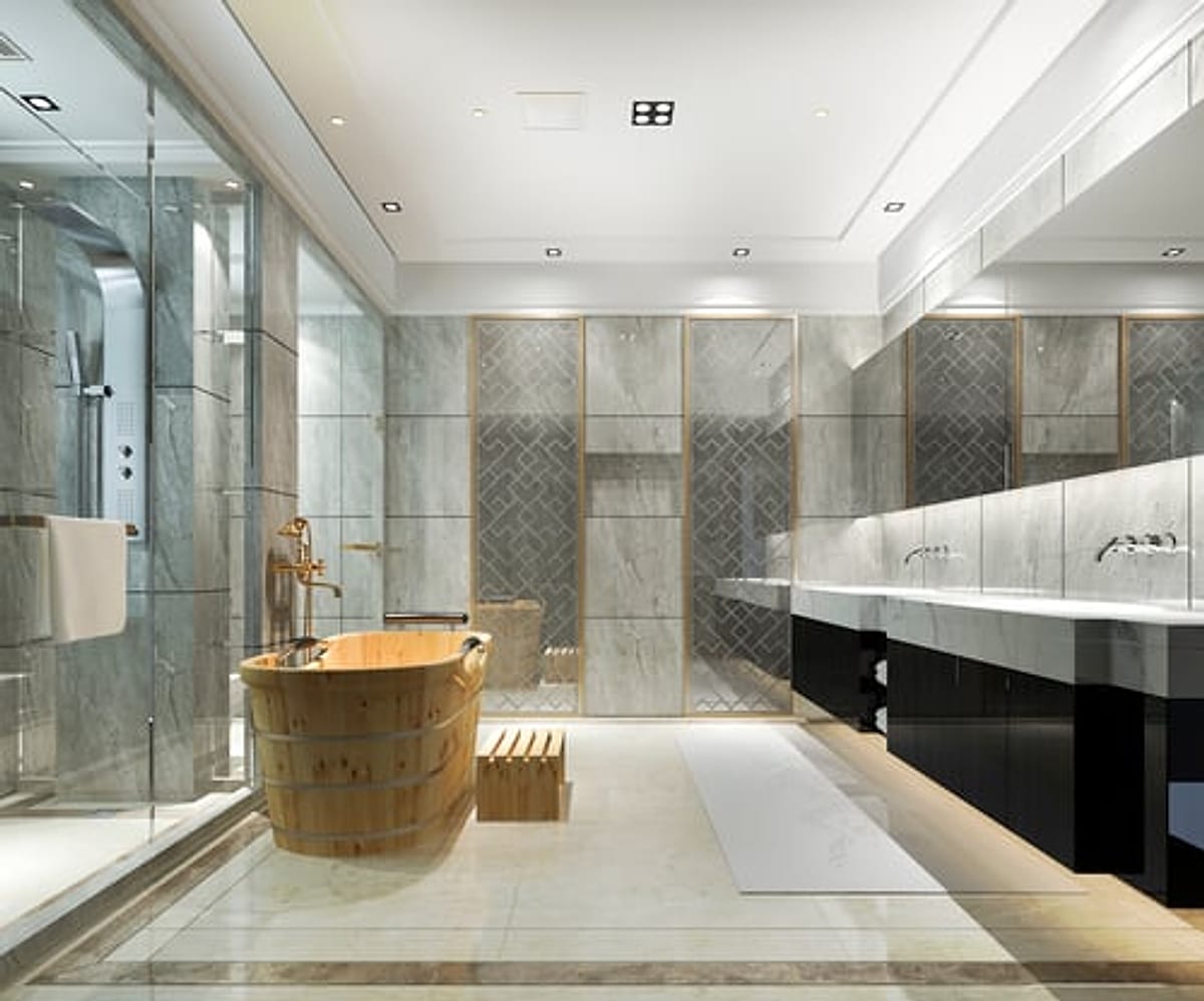 Spa-style walk-in shower with large-format marble tile and a glass enclosure in an Oklahoma City home